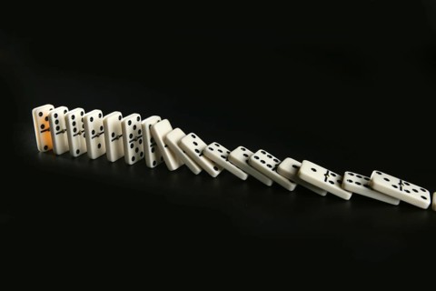 Domino game business metaphor of choosing the right way