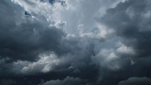 Dramatic dark storm clouds in sky background