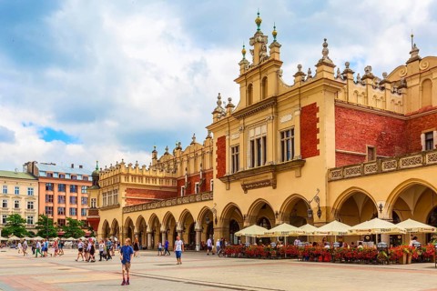 Krakow, Poland, June 18, 2019: The Cloth Hall panorama in the main market square Rynek Glowny,