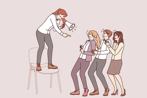 Woman manager shouts at subordinates through megaphone, intimidating employees to increase