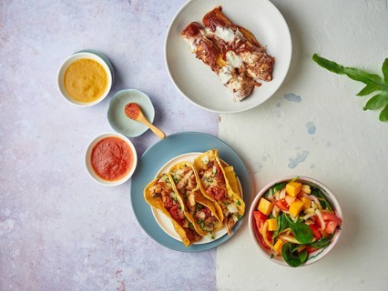 Mexican tacos with sauces and salad flat lay