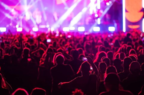 Crowd of people in front of the stage during the concert. Poland