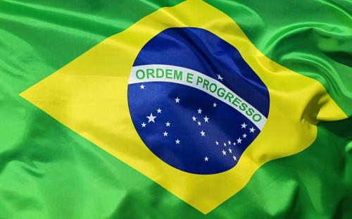 Close-up of the Brazilian national flag fluttering in the wind with folds and wave patterns