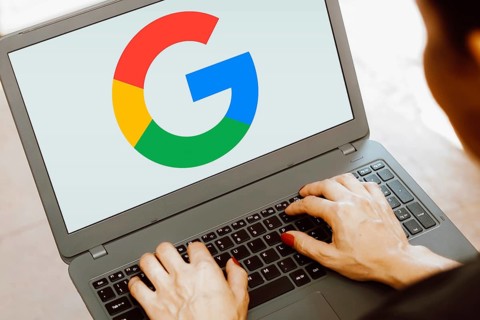 In this photo illustration, the Google logo is displayed on a notebook screen