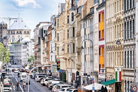 House facades from the end of the 19th century in the Belgian Quarter and the medieval church of St