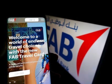 Stuttgart, Germany, 02-11-2022: Person holding cellphone with website of financial company First