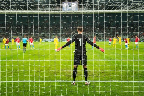 Net in the football goal penalty shootout in the background.