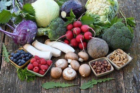 Healthy food, berries, cabbage, radishes, king oyster mushrooms, raspberries, nuts, blueberries,