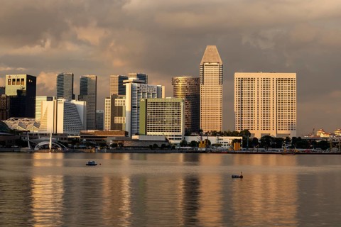 Skyline at sunset with Pan Pacific skyscraper and Mandarin Oriental Hotel, Marina Bay, Singapore,