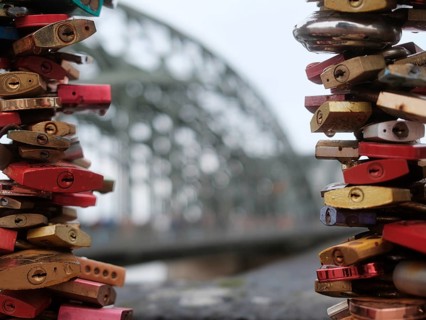 Love locks on a bridge over the Rhine, blurred background, Cologne, Germany, Europe