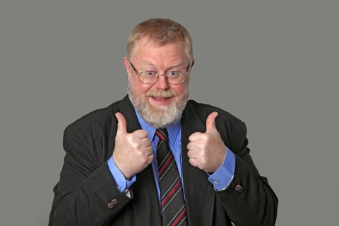 Man holds both thumbs up
