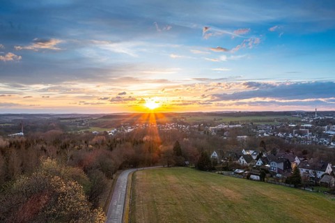 Sunset, Aerial view over forests and meadows of Westerwald, Altenkirchen, Germany, Europe