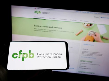 Stuttgart, Germany, 09-18-2022: Person holding mobile phone with logo of US Consumer Financial