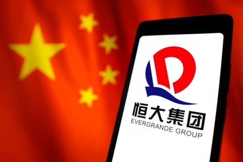 In this photo illustration, the Evergrande Real Estate Group logo is displayed on a smartphone