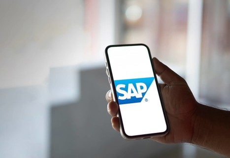 SAP SE logo is displayed on smartphone. SAP SE is a German multinational software company based in