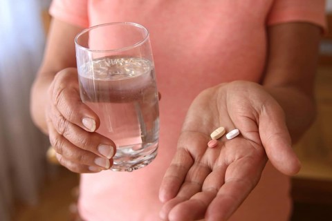 Woman accepts medicine