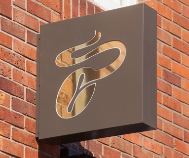 Coffee bean, Tschibo logo on a Tschibo branch, Bremen, Germany, Europe