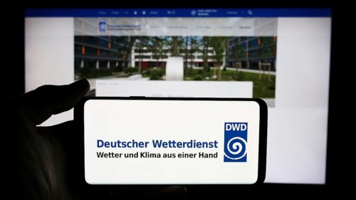 Stuttgart, Germany, 06-06-2024: Person holding cellphone with logo of German meteorological service