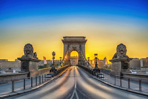 Budapest Hungary, city skyline sunrise at Chain Bridge with famous lion statue