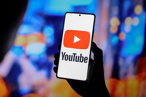 In this photo illustration, the YouTube logo is displayed on a smartphone screen