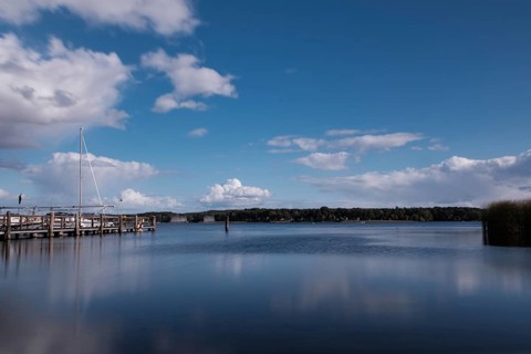 View over the Scharmützelsee with jetty and marina, long exposure, Wendisch-Rietz, Brandenburg,