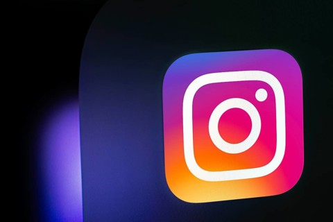A close up of an iPad screen displaying the instagram app icon