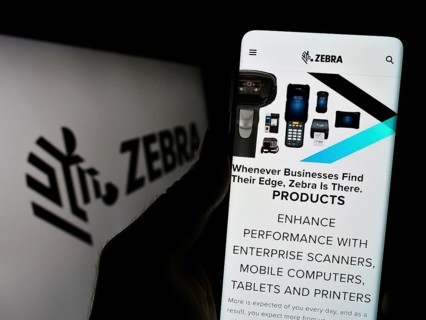 Stuttgart, Germany, 08-13-2023: Person holding cellphone with webpage of US company Zebra