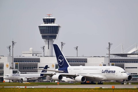 Lufthansa Airbus A380-800 with control tower, taxiing in front of Terminal 2 to runway South