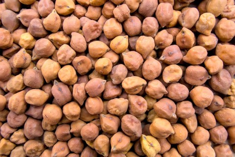Full-Frame Close-Up of Black or Brown Chickpeas with Textured Details, Top View