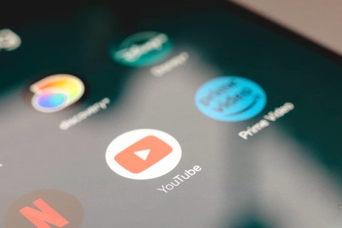 In this photo illustration, the app logo Netflix, YouTube and Prime Video is displayed on a