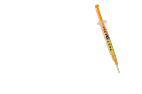 Syringe with vaccine isolated on white background and copy space