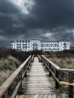 Dramatic clouds over the spa hotel on Juist, East Frisian Islands, Germany, Europe