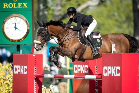Katie Laurie of Australia riding on Django II competes in the second round and jumpoff of the CPKC