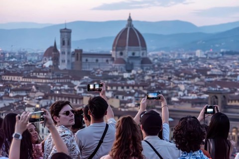 FLORENCE, ITALY, SEPTEMBER 21, 2023, Large tourist crowd on Piazzale Michelangelo enjoying sunset