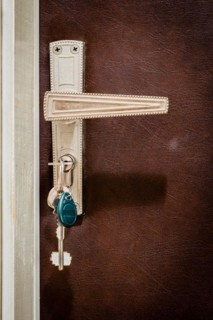 Home door. Keys are inserted in the lock of the entrance door of the apartment