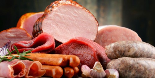 Assorted meat products including ham and sausages