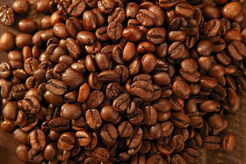 Toasted coffe beans texture under golden light