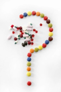 Candy sweets question mark isolated over white background and pills