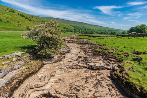 Yorkshire landscape with the dried-up River Skirfare near Litton, North Yorkshire, England, UK