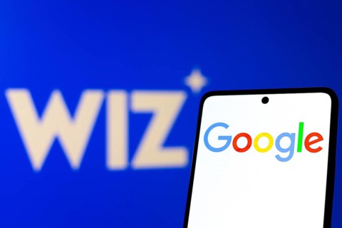 In this photo illustration, the Google logo is displayed on a smartphone screen, in the background