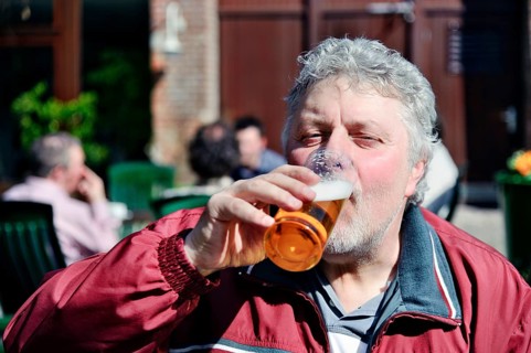 Thirsty man drinks a beer