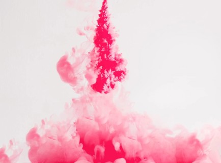 Bright ink drops dissolving underwater