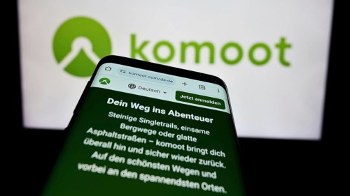 Stuttgart, Germany, 05-23-2024: Cellphone with web page of German route planning app company komoot