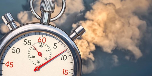 Fast reduce emissions. A stop clock with emissions in background