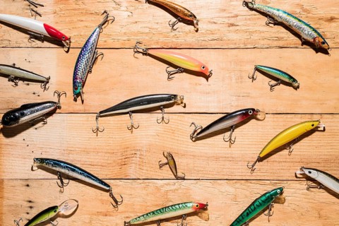 Colorful fishing lures wooden desk