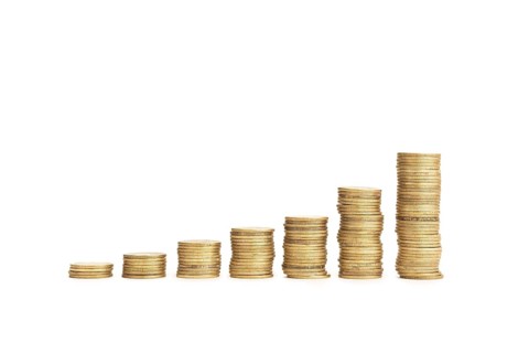 Rising Coin stacks on a white background. Growth, income, savings, investment concept. Symbol of