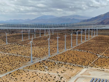 Aerial view of huge array of gigantic wind turbines spreading over the desert in Palm Springs wind