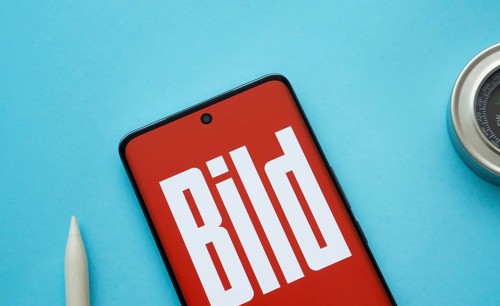 The logo of the German newspaper Bild is displayed on a smartphone screen