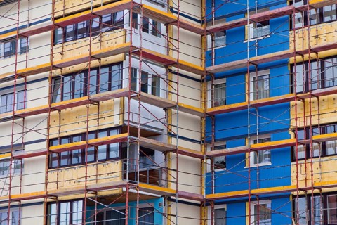 A residential building is being renovated. Insulation for energy saving and thermal insulation, A