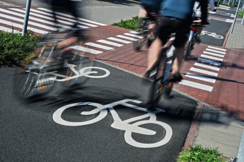 Bicycle road sign and bike riders